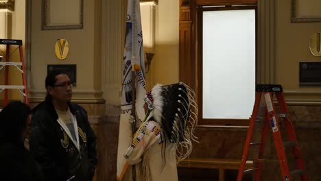 Chief-carrying-a-flag-at-the-Ute-flag-tribute-at-the-Denver-Capitol-building