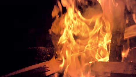 Close-up,-slow-motion-view-of-wood-burning-in-a-bonfire