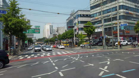 Shot-of-street-from-moving-bus-in-Seoul,-South-Korea