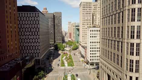 4k-aerial-video-of-downtown-detroit-woodward-ave-in-the-summer-2018-with-cars-driving-and-people-walking-on-a-sunny-day