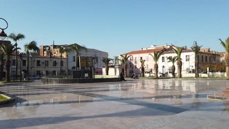 People-walking-in-Al-Kawthar-Mosque-yard-,-with-clear-weather-and-blue-sky-,-in-algeria-,-wilaya-de-blida-