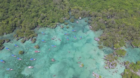 Top-down-crane-over-boats-in-vivid-turquoise-Kwale-Island-lagoon-in-Zanzibar