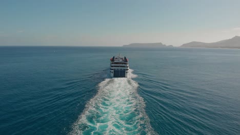 Aerial-shot-follow-island-Ferry-boat-leaving-water-trails-behind,-Porto-Santo