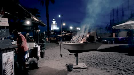 Man-preparing-fish-with-fire,-slow-cooking-with-brochettes