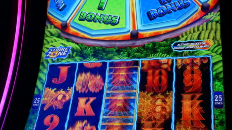 Motion-of-people-playing-slot-machine-inside-Casino,-focus-on-screen-with-4k-resolution