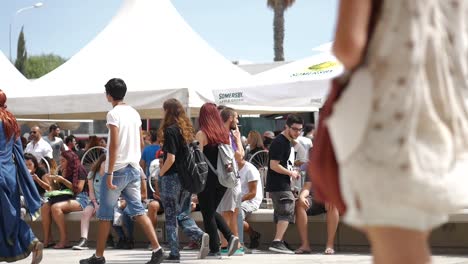 A-costumed-woman-walks-with-a-crowd-outside-the-Cyprus-Comic-Con-in-Nicosia,-Cyprus