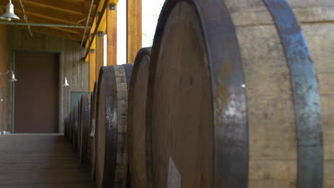 Close-up-of-a-row-of-Bourbon-Barrels-at-the-High-West-Distillery-near-Wanship,-Utah