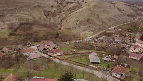 Aerial-view-of-an-old-church-in-a-romanian-village