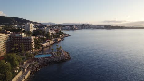 Hotels-And-Resorts-At-Bay-Of-Palma-In-Mallorca,-Sunset-Aerial-Shot