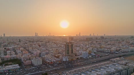 Establishing-aerial-shot-showcasing-Jeddah-city-illuminated-by-the-Saudi-Arabian-sunset-light