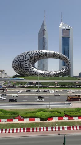 Dubai's-Museum-of-the-Future-presents-a-stunning-view,-accompanied-by-Sheikh-Zayed-Road-and-the-city's-traffic