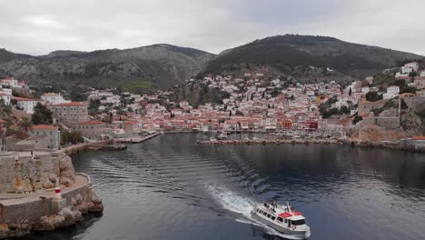 Passenger-Ship-Sailing-Away-From-Port-On-Hydra-Island-In-Greece