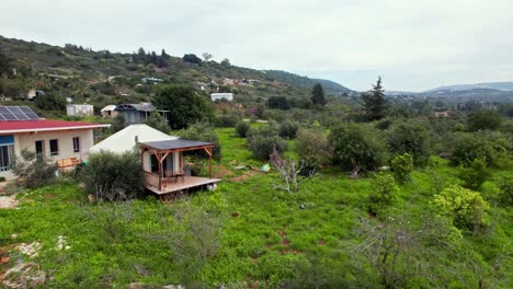 Drone-shot-of-a-Yurt-tent-bed-and-breakfast-in-the-ecological-community-settlement-Klil