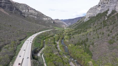 Aerial-track-of-highway-through-American-Fork-Canyon-near-Bridal-Veil-Falls,-Utah-during-spring