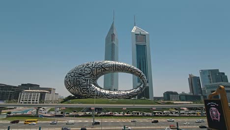 A-stunning-view-of-Dubai's-Museum-of-the-Future,-along-with-Sheikh-Zayed-Road-and-city-traffic