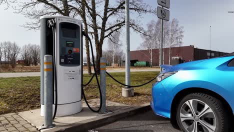 Charging-Electric-Vehicle-At-CSDD-Charging-Station-In-Valmiera,-Latvia