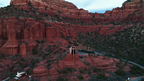 Aerial-View-Of-Chapel-of-the-Holy-Cross,-Catholic-Church-With-Mountains-In-The-Background-In-Sedona,-Arizona