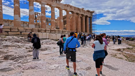 Parthenon-Acropolis-tourist-walking-inside-temple-complex-point-of-view-Athens-Greece