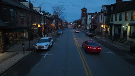 Low-aerial-above-town-street-in-USA