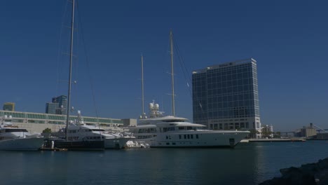 Panning-shot-of-the-pier-with-superyachts-including-Dum-Luck-and-New-Secret-parked-alongside-the-Hilton-hotel-and-SD-convention-center