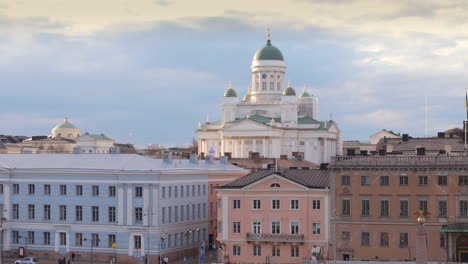 Aerial-riser-reveal-shot-of-Helsinki-cathedral-with-iconic-green-dome,-Finland