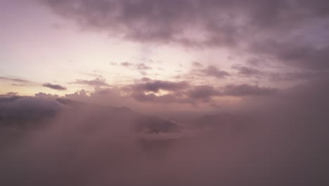 Drone-flight-through-the-morning-mist-and-sunrise-sky