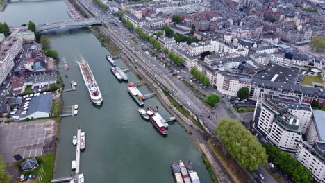 Boats-and-barges-on-the-seine-river-in-rouen,-france-during-the-day,-aerial-view
