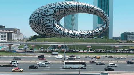 Dubai-traffic-on-Sheikh-Zayed-Road,-framed-by-the-Museum-of-the-Future-and-Emirates-Towers-in-the-background,-United-Arab-Emirates