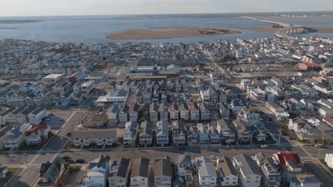 Aerial-view-of-a-town-situated-beside-a-beach-during-afternoon