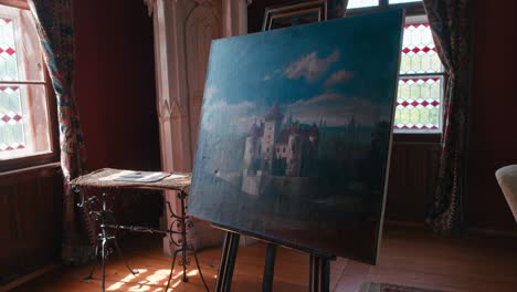 Julijana-Room-in-Trakošćan-Castle-,-featuring-an-easel-with-a-castle-painting