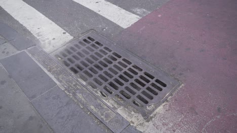 New-York-City-Sewer-with-pedestrian-walking-on-the-main-capital-city-street-road
