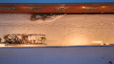 Snow-on-pedestrian-walkway-at-night