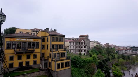 Trabzon,-Turkey:-Crossing-a-bridge-and-observing-a-park-that-extends-to-the-Black-Sea,-offering-scenic-views-and-a-tranquil-atmosphere