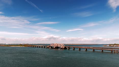An-aerial-view-of-the-South-Channel-Subway-Bridge-in-Jamaica-Bay-on-a-sunny-day-with-blue-skies-and-white-clouds