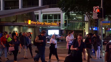 Pedestrians-crossing-the-road-on-Albert-and-Adelaide-street-in-Brisbane-city,-between-King-George-Square-busway-station-and-Queen-Street-Mall,-bus-interchange,-static-shot