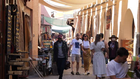 Travelers-On-The-Narrow-Streets-At-Marrakesh-Medina-In-Morocco