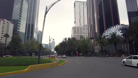 Touring-through-the-streets-of-Mexico's-City-downtown-shot-from-a-car-perspective