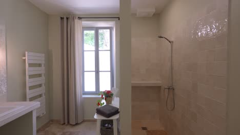Slow-establishing-shot-of-a-bathroom-and-shower-room-in-a-luxury-villa