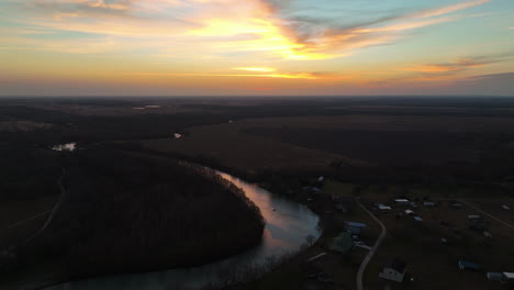 Aerial-View-Of-River-And-Fields-At-Sunset---Drone-Shot