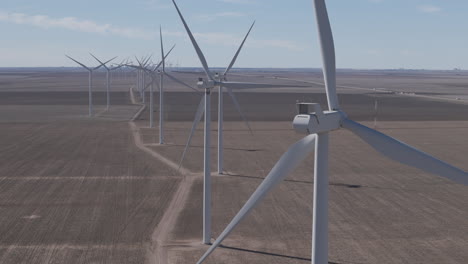 Texas-WInd-Farms---Telephoto-Track-Sideways-Past-Long-line-of-Turbines