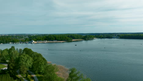 A-panoramic-view-of-Ukiel-Lake-in-Olsztyn,-featuring-calm-waters-and-surrounding-greenery