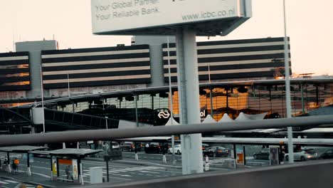 Traveling-On-The-Road-With-View-Of-Amsterdam-Airport-Schiphol-In-Netherlands---tracking-shot