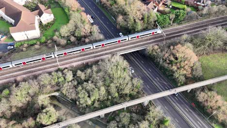 Train-crossing-bridge-Wickford-Essex-UK-town-centre-drone,aerial