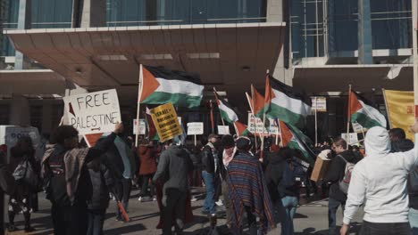 Palestinian-protestors-hold-flags-and-signs-outside-the-AIPAC-Israel-lobby-conference