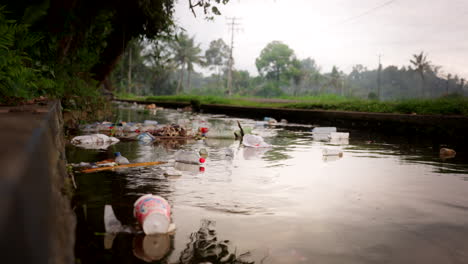 Floating-Litter-Garbages-In-A-River-In-Bali,-Indonesia