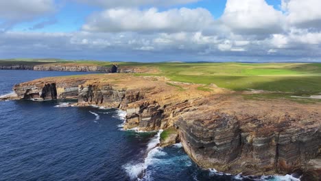 Drone-Shot-of-Yesnaby-Cliff-and-Vista-Point-on-Coastline-of-Orkney,-Scotland-UK-on-Sunny-Day