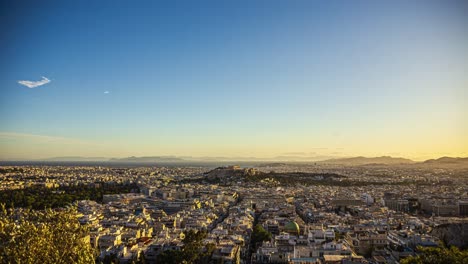 Wide-Time-lapse-of-the-city-of-Athens-and-the-Akropolis-hill,-sunset-in-Greece