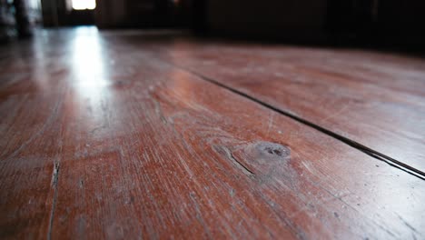 Close-up-of-a-rustic-wooden-floor-with-visible-grain-and-knots-in-Trakoscan-Castle,-Croatia