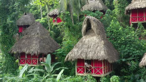 One-person-relaxing-in-tree-house-at-El-Valle-village,-Samana-in-Dominican-Republic