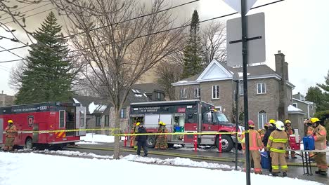 Fire-engines-and-firefighters-at-school-fire-in-Montreal,-moving-view